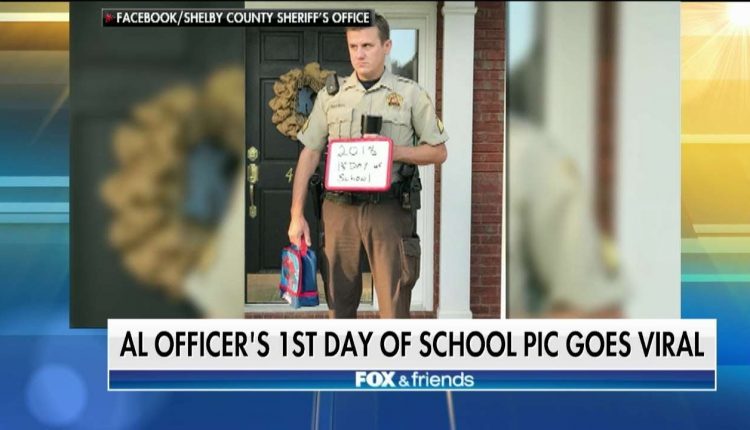Alabama School Resource Officer's Reluctant Back-to-School Photo Goes Viral