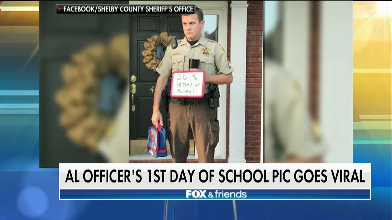 Alabama School Resource Officer's Reluctant Back-to-School Photo Goes Viral