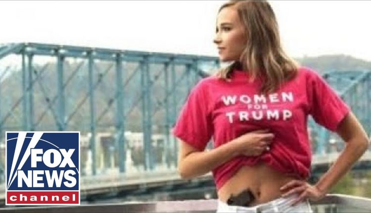 College senior poses for graduation picture with a gun in her waistband