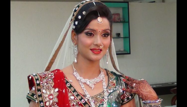 Indian Bridal Makeup And Hairstyle - Off White, Gold And Green Look